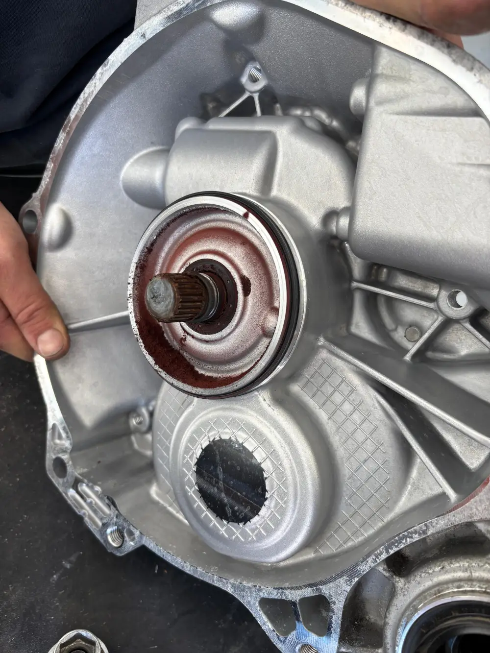 A drive unit cover with the rotor shaft splines and a bearing seat stained by water ingress