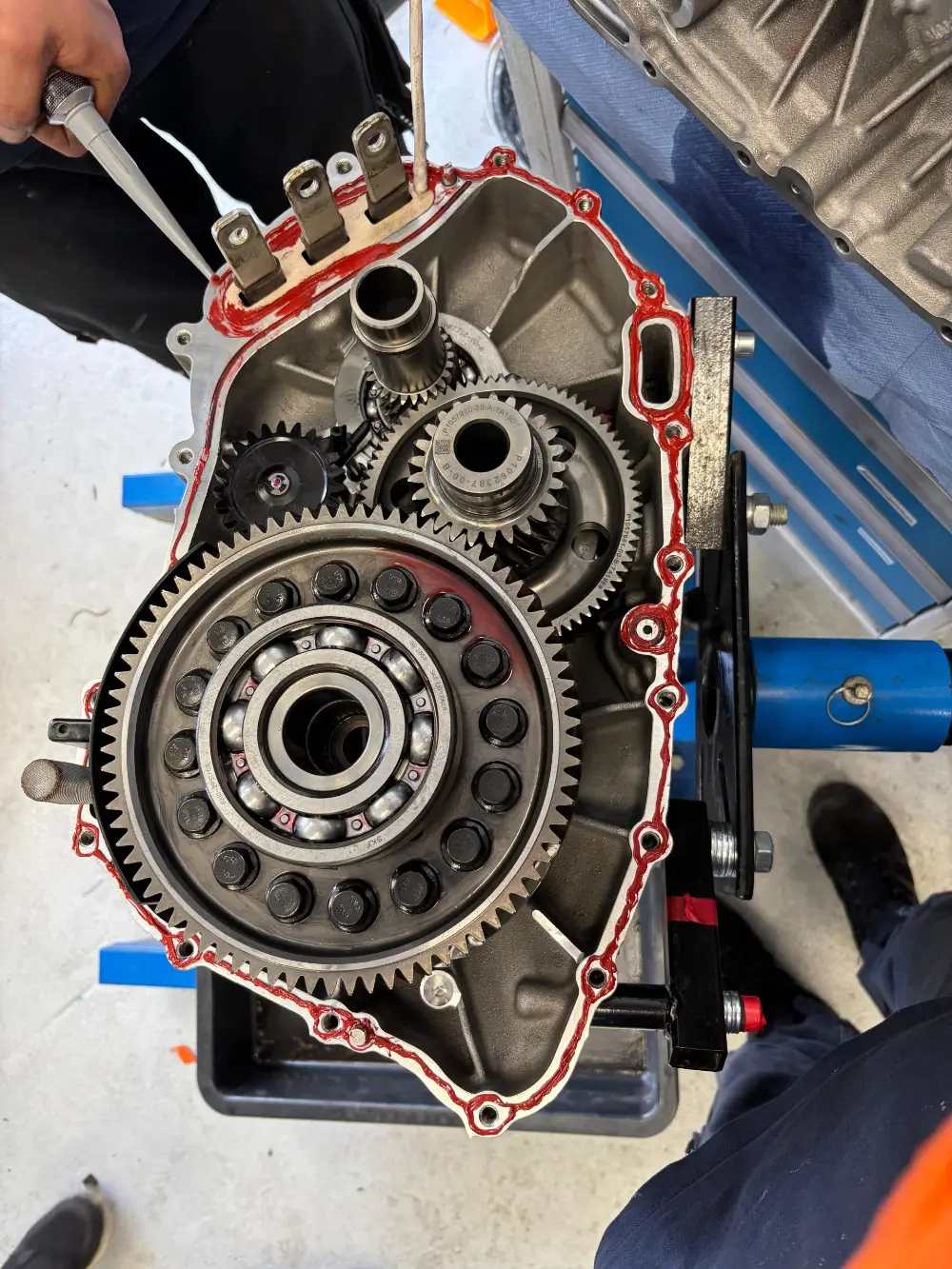 A large drive unit opened at the mating face, gear train and main bearing exposed